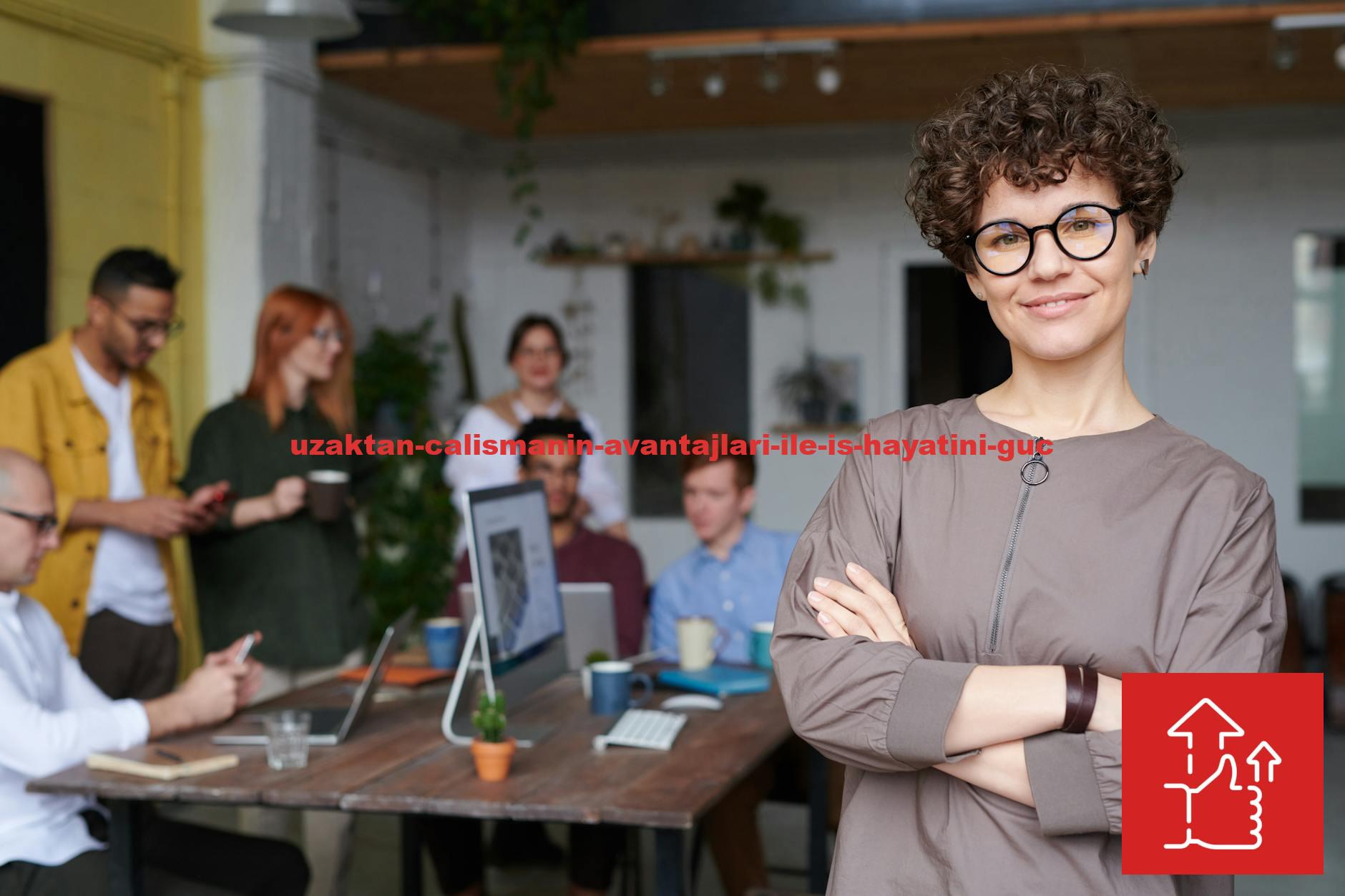 Smiling businesswoman with curly hair stands confidently in a modern office space with colleagues.