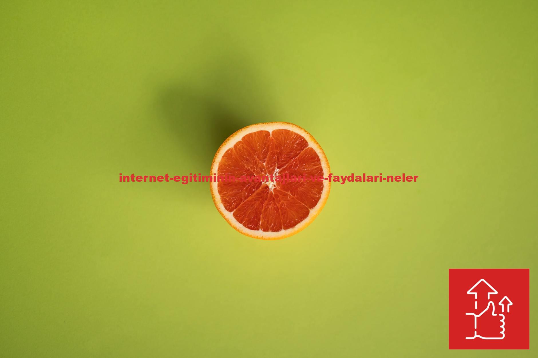 Top view of a fresh grapefruit slice on a vibrant green background, perfect for health and wellness themes.