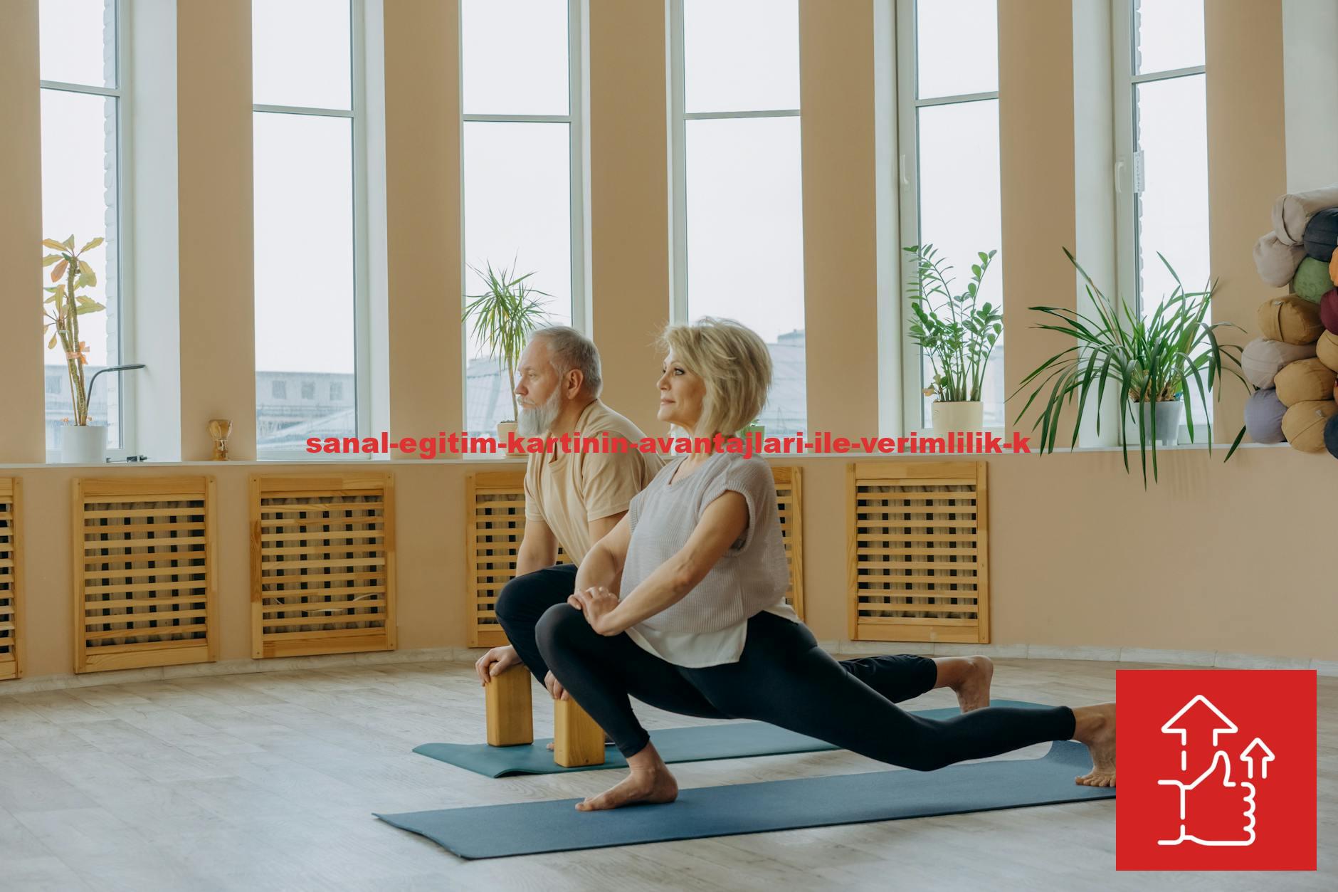 A senior couple practicing yoga indoors, focusing on a healthy lifestyle and flexibility.