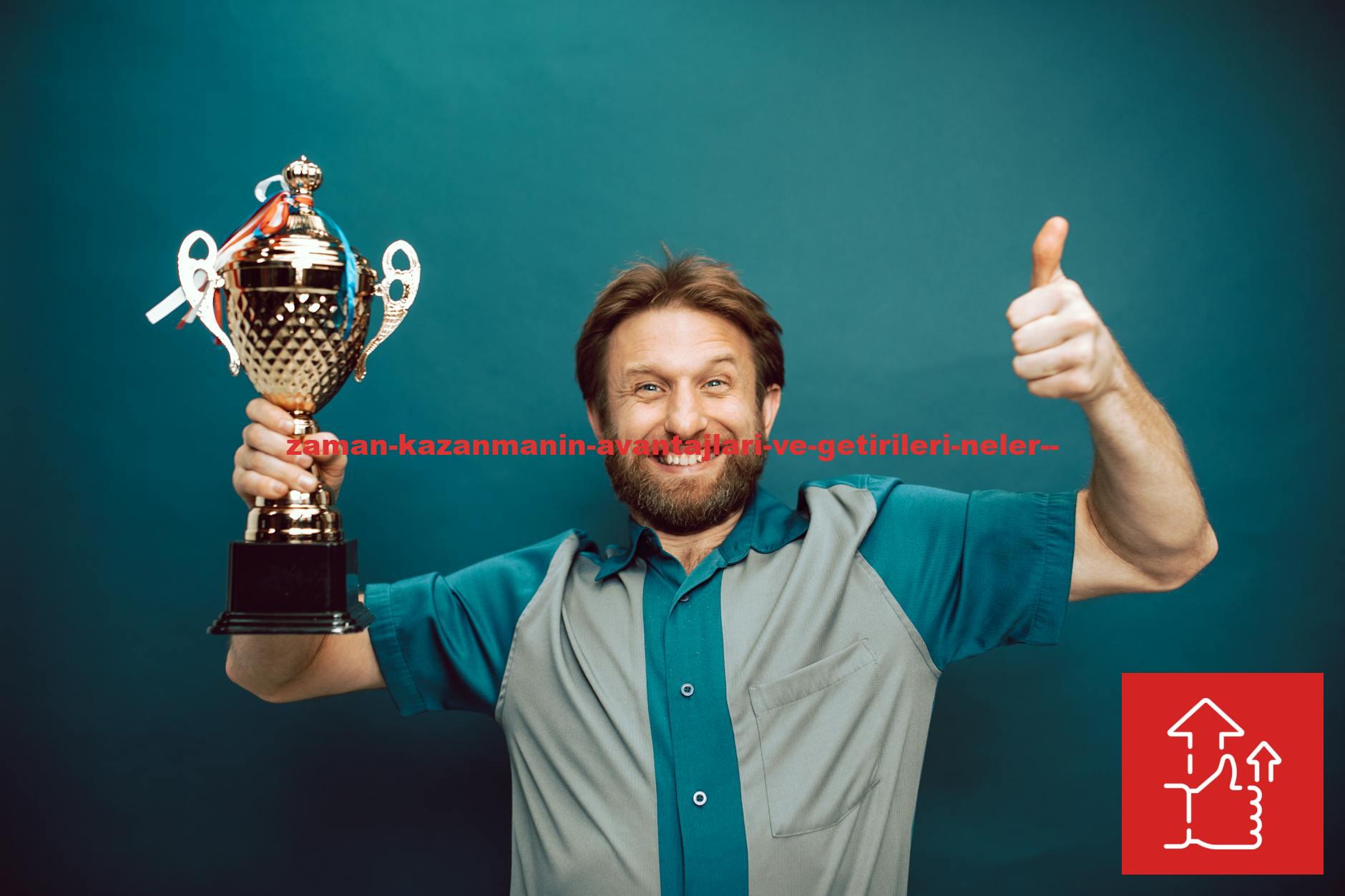 Smiling man holding a trophy and giving a thumbs up gesture against a blue backdrop.
