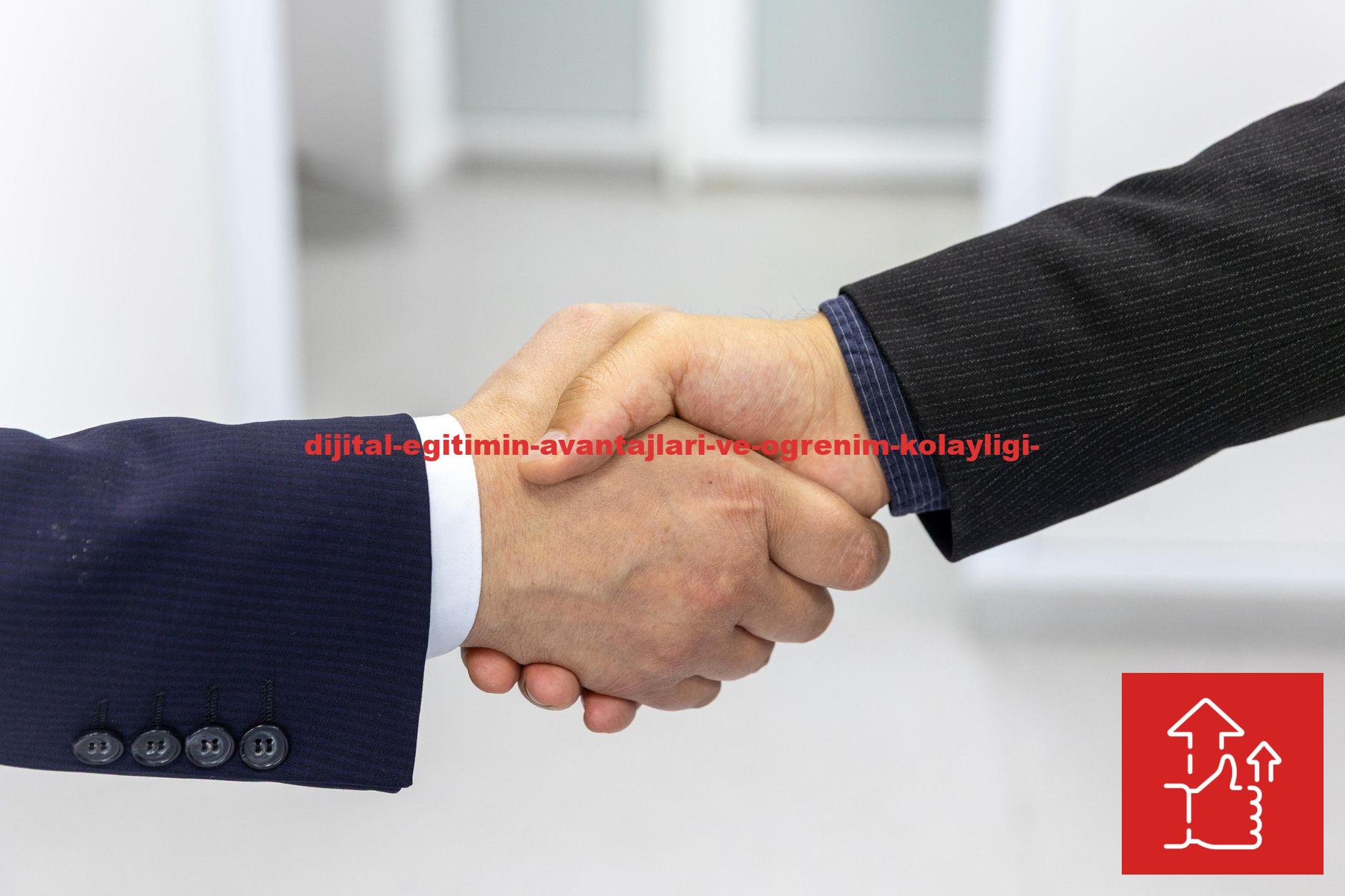 Close-up of a handshake in a business environment, symbolizing partnership.