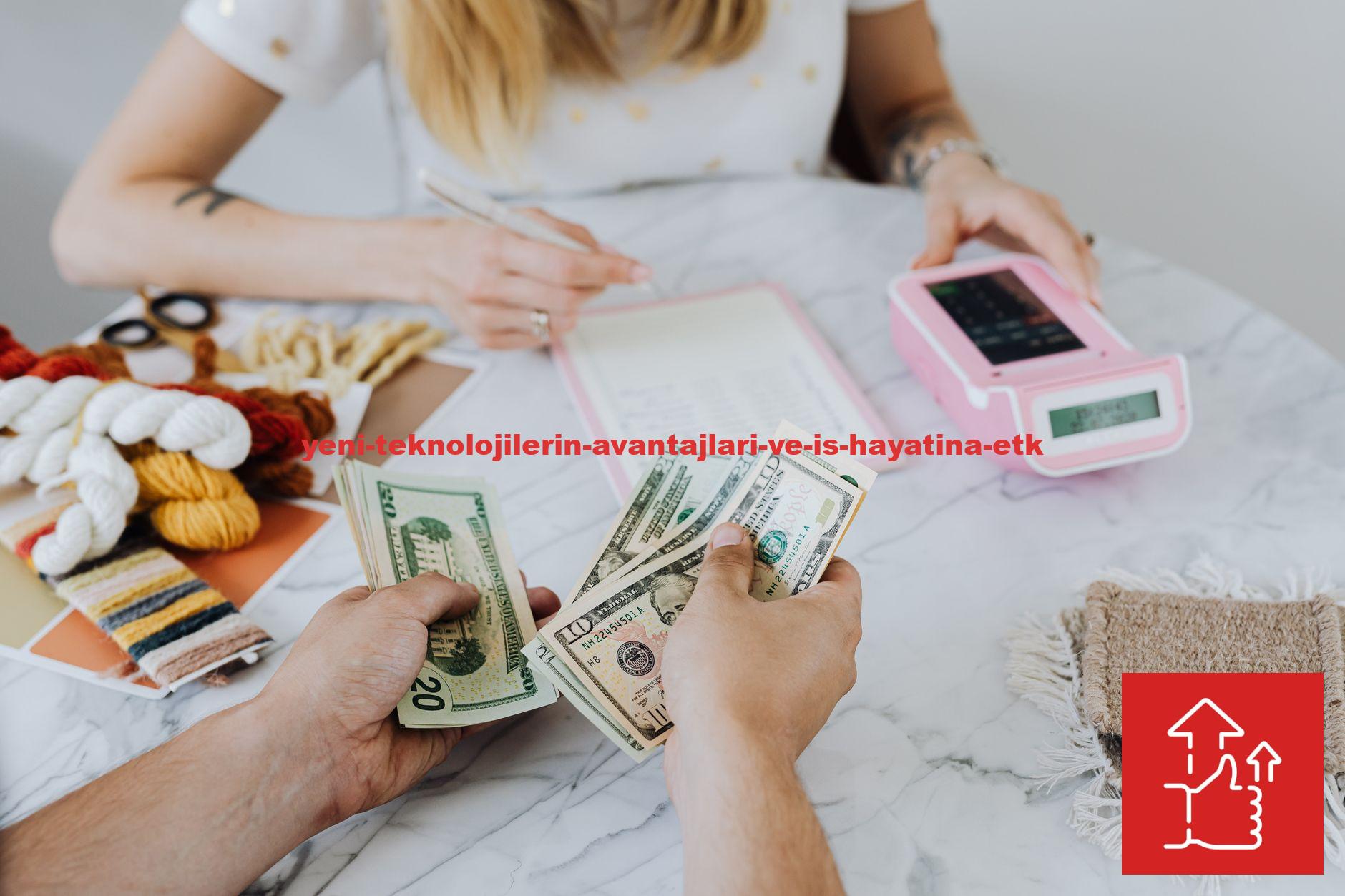 Two people handling cash and budgeting with a calculator and notebook at a table.